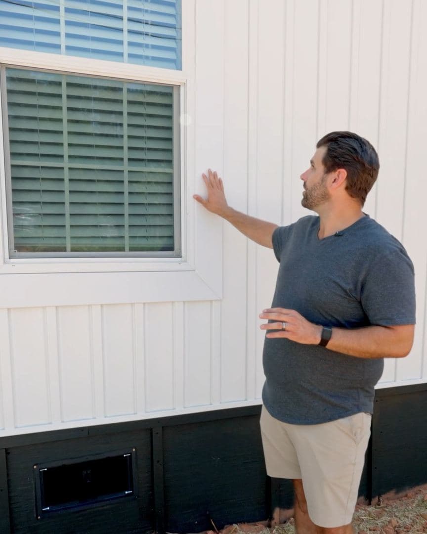 White board and batten siding and a 5-inch window surround on the Cavco Vivid
